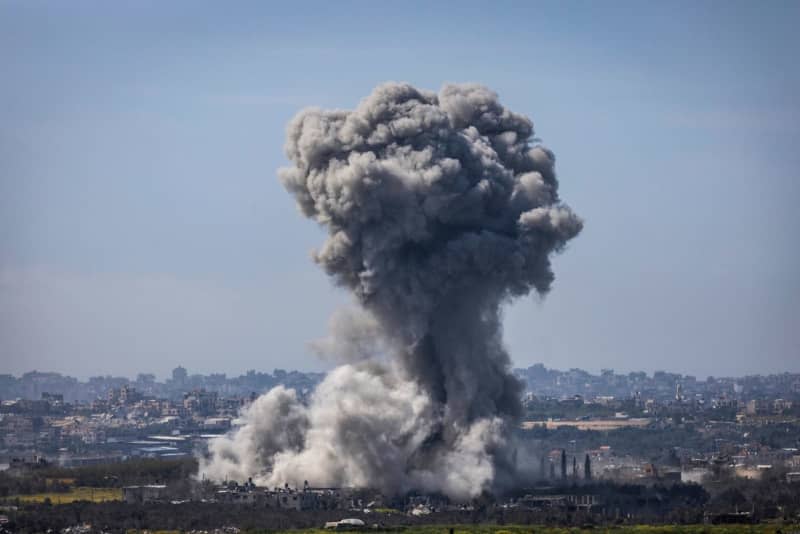 Thick smoke billows from an explosion on the Israel-Gaza border, as seen from Sderot. Ilia Yefimovich/dpa