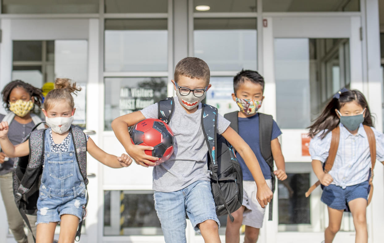 Parents are seeing positive changes in their kids as they go back to in-person learning. (Photo: FatCamera/Getty)