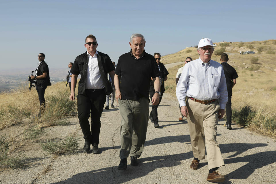 FILE - in this Sunday, June 23, 2019 file photo, US National Security Advisor John Bolton, right, and Israeli Prime Minister Benjamin Netanyahu, visit an old army outpost overlooking the Jordan Valley between the Israeli city of Beit Shean and the Palestinian city of Jericho. Netanyahu vowed Tuesday, September 10, 2019 to begin annexing West Bank settlements if he wins national elections next week. (AP Photo/Abir Sultan, File)