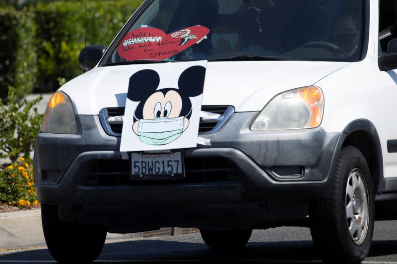 Disney cast members stage a car caravan outside Disneyland California, calling for higher safety standards for Disneyland to reopen