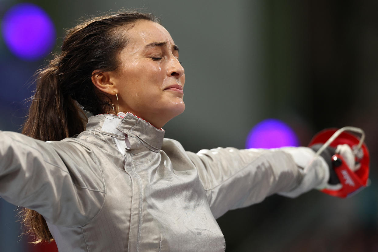 France's Sara Balzer celebrates after winning against Hungary's Luca Virag Szucs in the women's sabre individual quarter-final bout during the Paris 2024 Olympic Games at the Grand Palais in Paris, on July 29, 2024. (Photo by Franck FIFE / AFP)