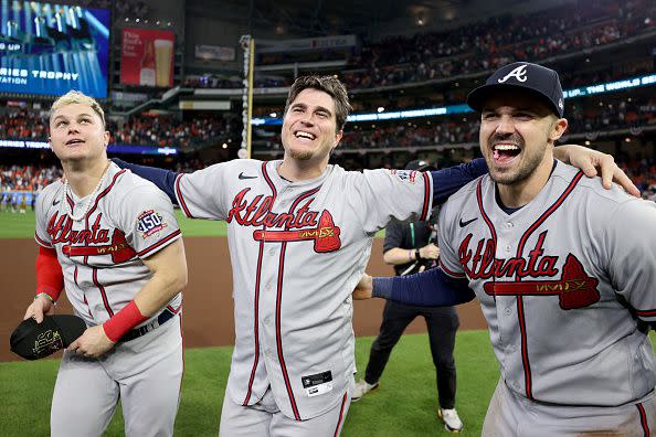 HOUSTON, TEXAS - NOVEMBER 02: (L-R) Joc Pederson #22, Luke Jackson #77, and Adam Duvall #14 of the Atlanta Braves celebrate on the field after defeating the Houston Astros 7-0 in Game Six of the World Series at Minute Maid Park on November 02, 2021 in Houston, Texas. (Photo by Elsa/Getty Images)
