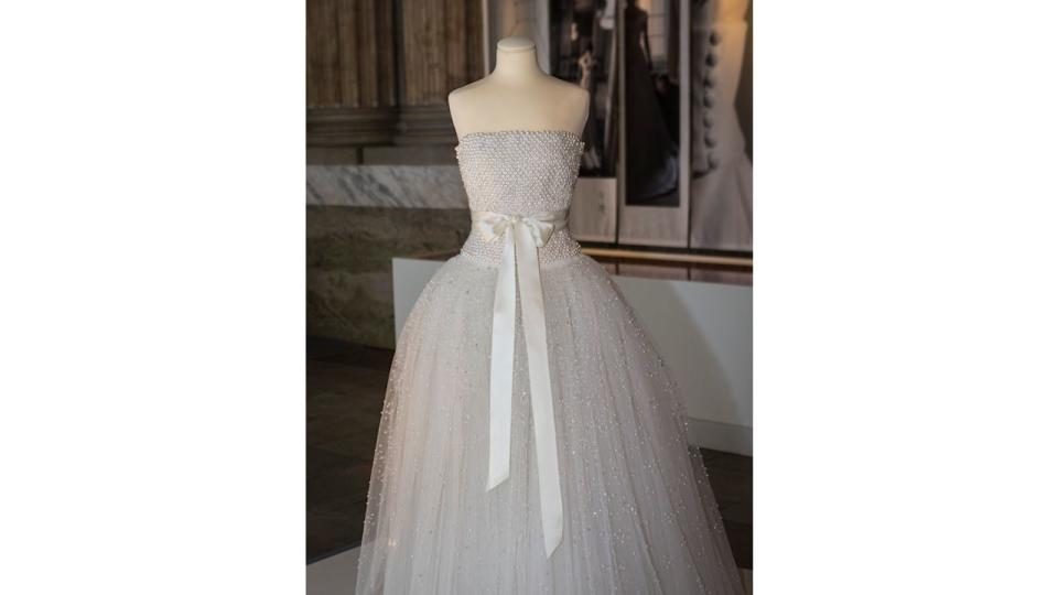 white strapless dress with bow on display