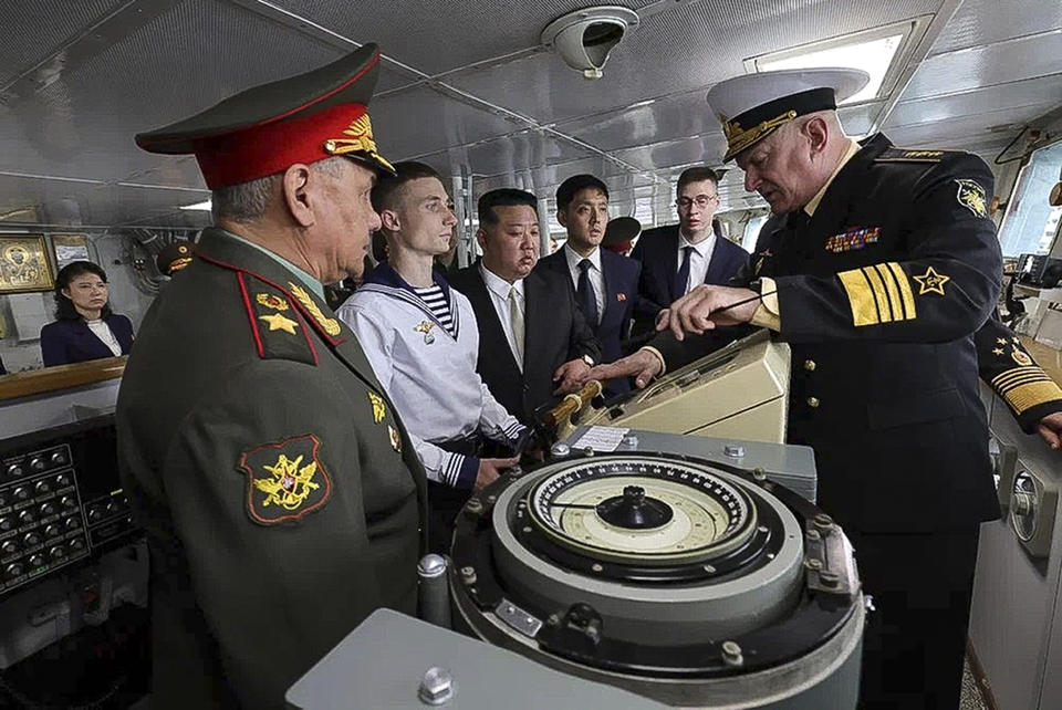 In this photo released by Russian Defense Ministry Press Service, North Korea's leader Kim Jong Un, center, and Russian Defense Minister Sergei Shoigu, left, listen explanations by Admiral Nikolai Yevmenov, Commander-in-Chief of the Russian Navy, right, while visitig the Admiral Shaposhnikov frigate of the Russian navy in the port of Vladivostok, Russian Far East on Saturday, Sept. 16, 2023. The visit was part of Kim's trip across Russia's Far East that has featured talks with Russian President Vlaidmir Putin and sparked Western concerns about an arms deal between the two old allies.(Russian Defense Ministry Press Service via AP)