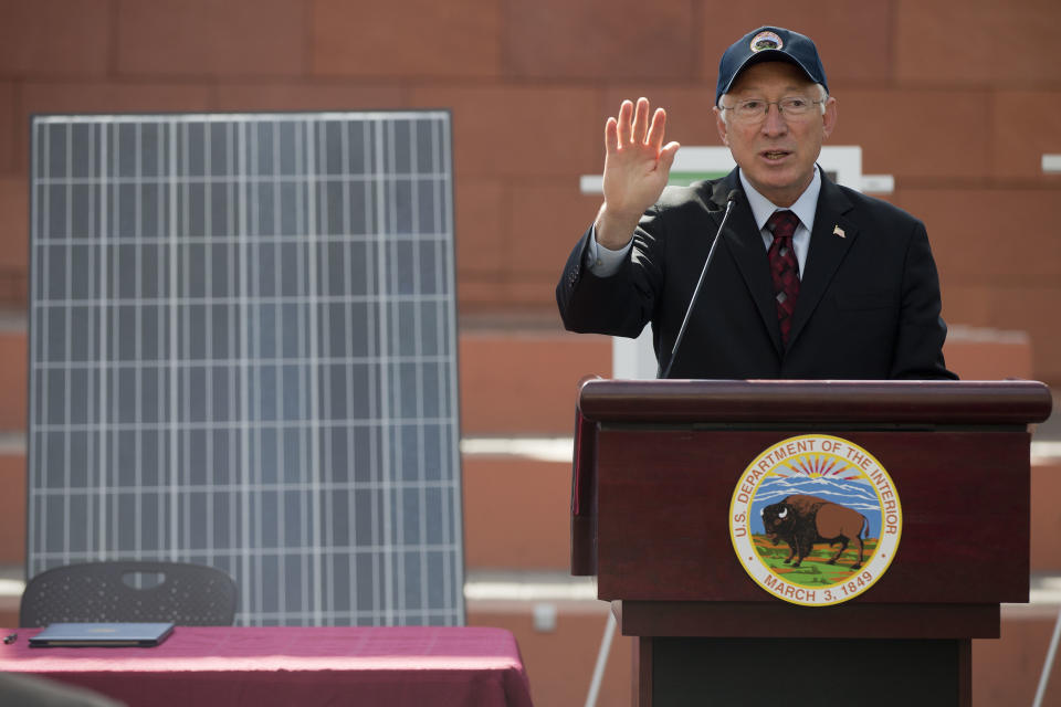 Interior Secretary Ken Salazar speaks during a news conference, Friday, Oct. 12, 2012, in Las Vegas, in which he and Senate Majority Leader Harry Reid announced a plan that sets aside 285,000 acres of public land for the development of large-scale solar power plants. The government is establishing 17 new "solar energy zones" on 285,000 acres in six states: California, Nevada, Arizona, Utah, Colorado and New Mexico. Most of the land,153,627 acres, is in Southern California. (AP Photo/Julie Jacobson).