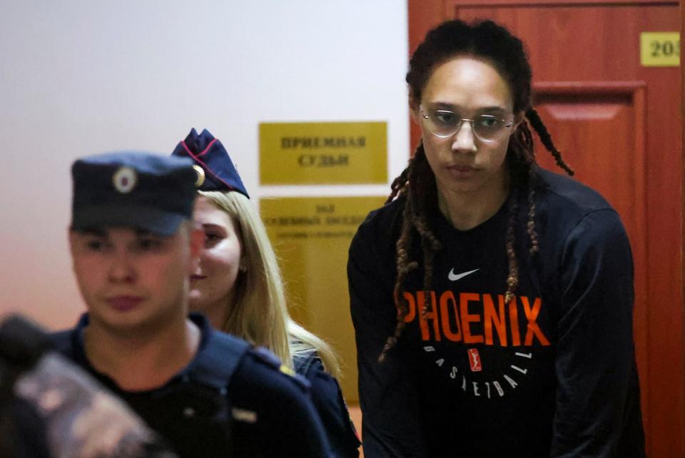 WNBA star and two-time Olympic gold medalist Brittney Griner is escorted to a courtroom for a hearing, in Khimki just outside Moscow, Russia, on July 27, 2022.