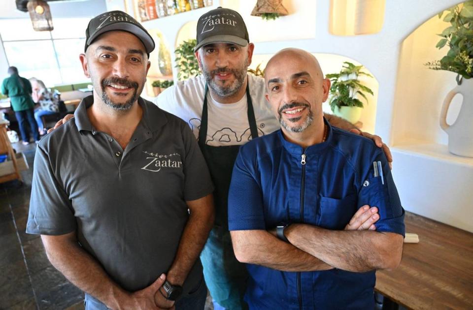 Brothers Roy Nassar, left, Rabih “Robby” Nassar in center, and Badih Nassar, right, have opened Zaatar Bistro in north Fresno’s Via Montana Shopping Center at Shepherd Avenue and Champlain Drive.