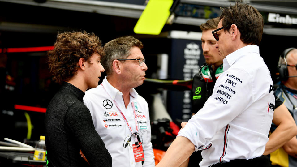 Andrea Kimi Antonelli (left), age 17, speaks with Toto Wolff, team principal of Formula 1's Mercedes-AMG Petronas team, before the fifth round of the 2024 Formula 2 Championship series in Monaco.