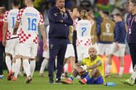 Brazil's Neymar sits on the pitch at the end of the World Cup quarterfinal soccer match between Croatia and Brazil, at the Education City Stadium in Al Rayyan, Qatar, Friday, Dec. 9, 2022. (AP Photo/Darko Bandic)