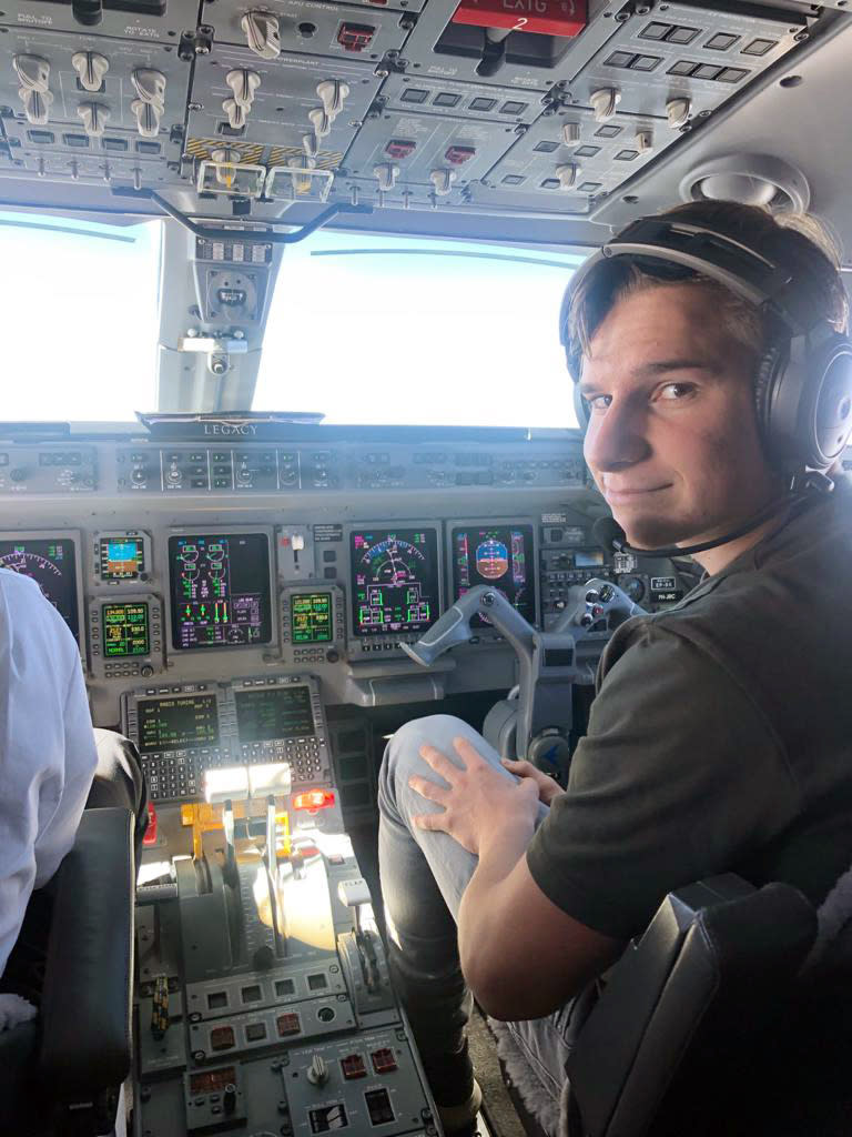 This 2021 photo provided by his family shows Oliver Daemen in an airplane cockpit. The 18-year-old from the Netherlands is about to become the youngest person in space. Blue Origin announced Thursday, July 15, 2021, that the teenager will be traveling on the July 20 launch in West Texas. (Daemen Family via AP)