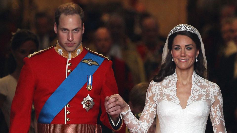 Prince William and Princess Kate walking hand and hand out of Westminster Abbey