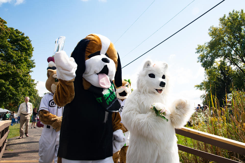 <p>Mascots lead the way for the procession into Northwestern Medicine Field.</p>