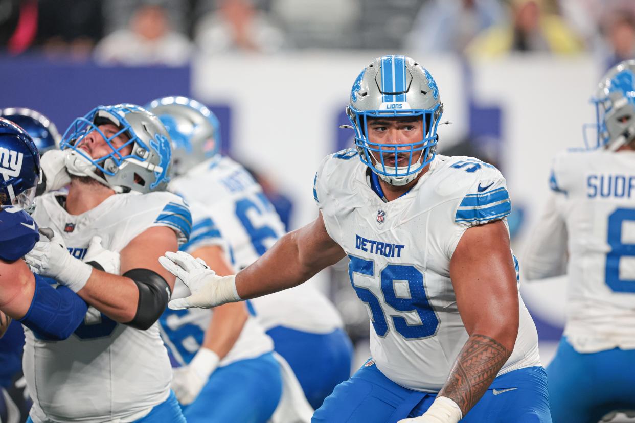 Aug 8, 2024; East Rutherford, New Jersey, USA; Detroit Lions offensive tackle Giovanni Manu (59) blocks during the second half against the New York Giants at MetLife Stadium. Mandatory Credit: Vincent Carchietta-USA TODAY Sports