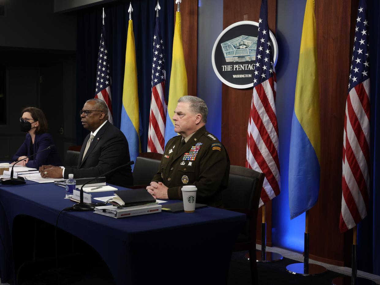 U.S. Secretary of Defense Lloyd Austin (2nd L) gives opening remarks as Chairman of the Joint Chiefs of Staff General Mark Milley (R) and Deputy Assistant Secretary of Defense for Russia, Ukraine, Eurasia Laura Cooper (L) listen during a virtual meeting of the Ukraine Defense Contact Group at the Pentagon May 23, 2022 in Arlington, Virginia.