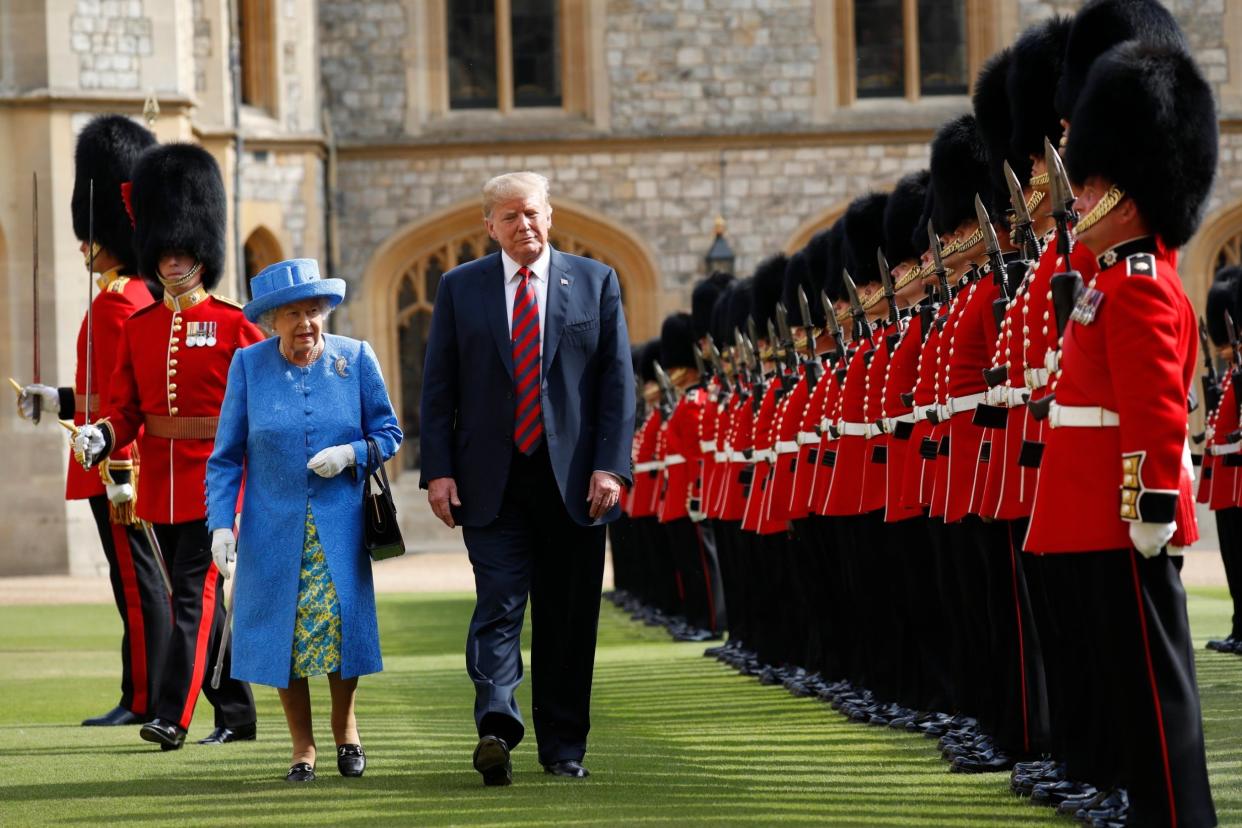 US President Donald Trump with the Queen inspecting the Guard of Honour at Windsor Castle: AP