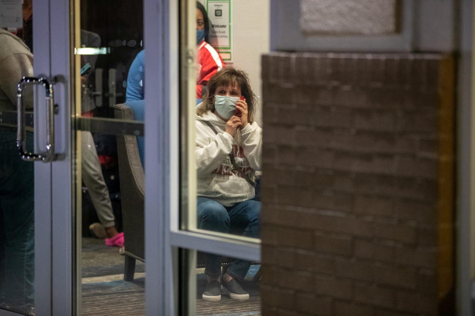 Family members await information about their loved ones who work at the FedEx facility after a mass casualty shooting in Indianapolis, Indiana, U.S. 