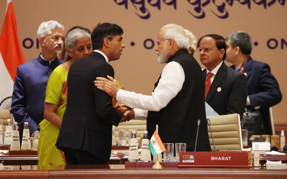 Prime Minister Rishi Sunak (left) greets Indian Prime Minister Narendra Modi