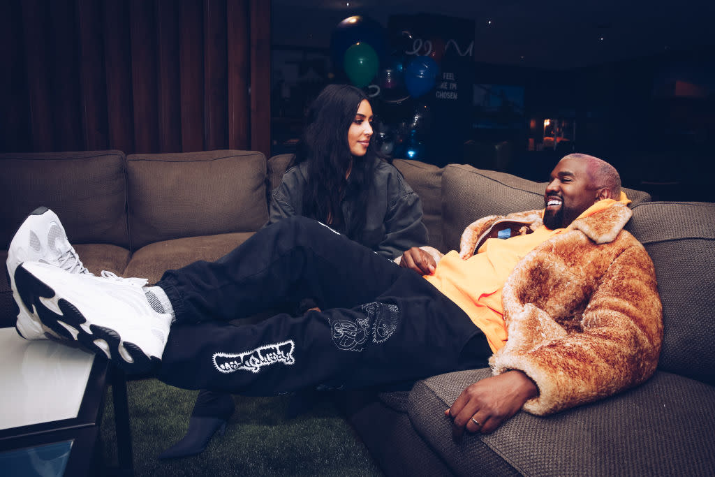 Kim Kardashian and Kanye West relax backstage at The Forum on Dec. 19, 2018 in Inglewood, California. (Photo: Rich Fury/Forum Photos via Getty Images) 