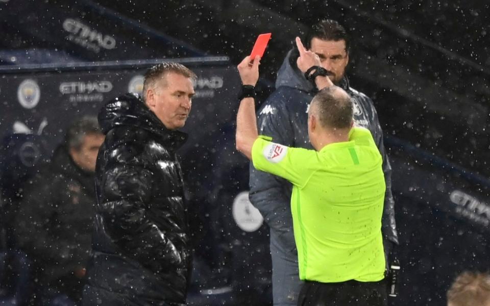 Referee Johnathan Moss shows the red card to Aston Villa's head coach Dean Smith  - AP