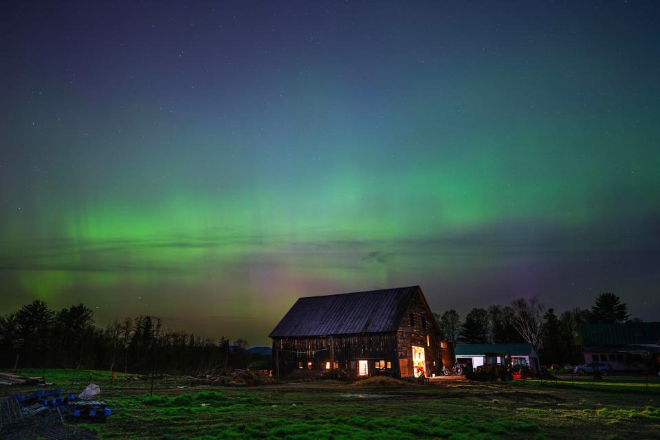 The northern lights fill the sky with green ribbons of electrical charged particles over Greaney's Turkey Farm in Mercer, Maine on May 11, 2024. This display was the strongest seen since 2003, rating a G5 on the geomagnetic scale.