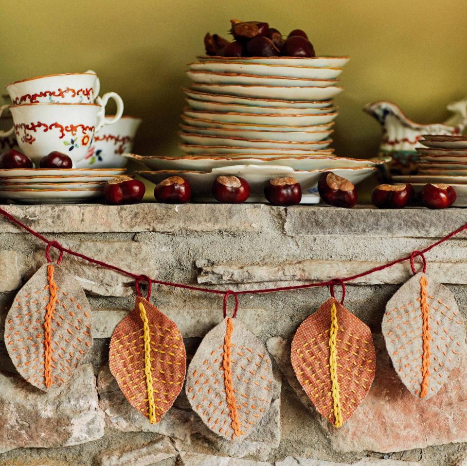 autumn leaf garland hanging on mantlepiece