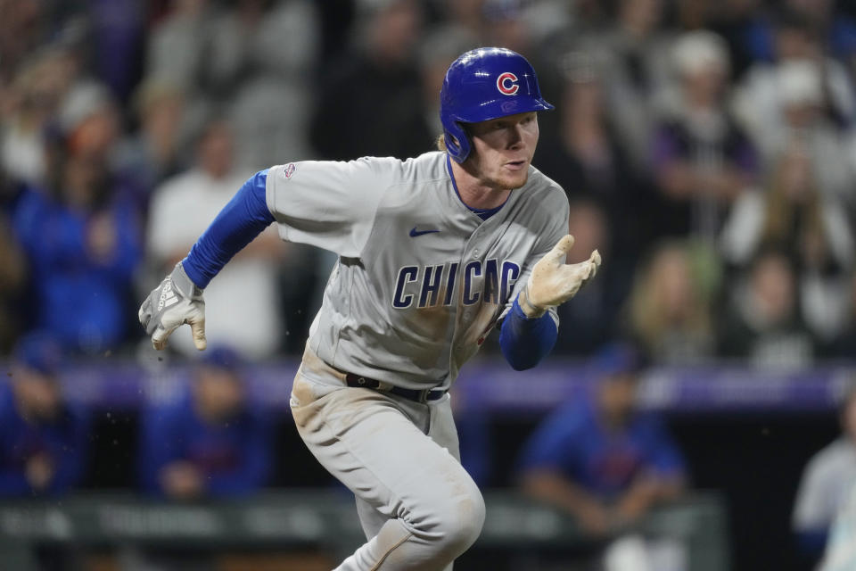 Chicago Cubs' Pete Crow-Armstrong heads up the first-base line after putting down a sacrifice bunt in his first major league at-bat, against Colorado Rockies relief pitcher Tyler Kinley in the ninth inning of a baseball game Monday, Sept. 11, 2023, in Denver. (AP Photo/David Zalubowski)