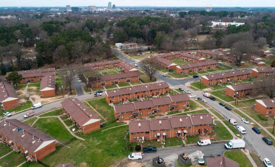 In this 2020 file photo, contractors work on building renovations in McDougald Terrace in February 2020. The Durham Housing Authority started a voluntary evacuation of the public housing complex in early January amid concerns about high carbon monoxide levels, mold and other conditions.