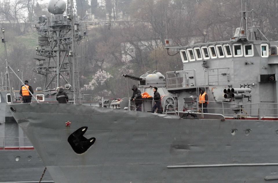 Sailors are seen on a Russian military vessel anchored at a navy base in the Ukrainian Black Sea port of Sevastopol in Crimea