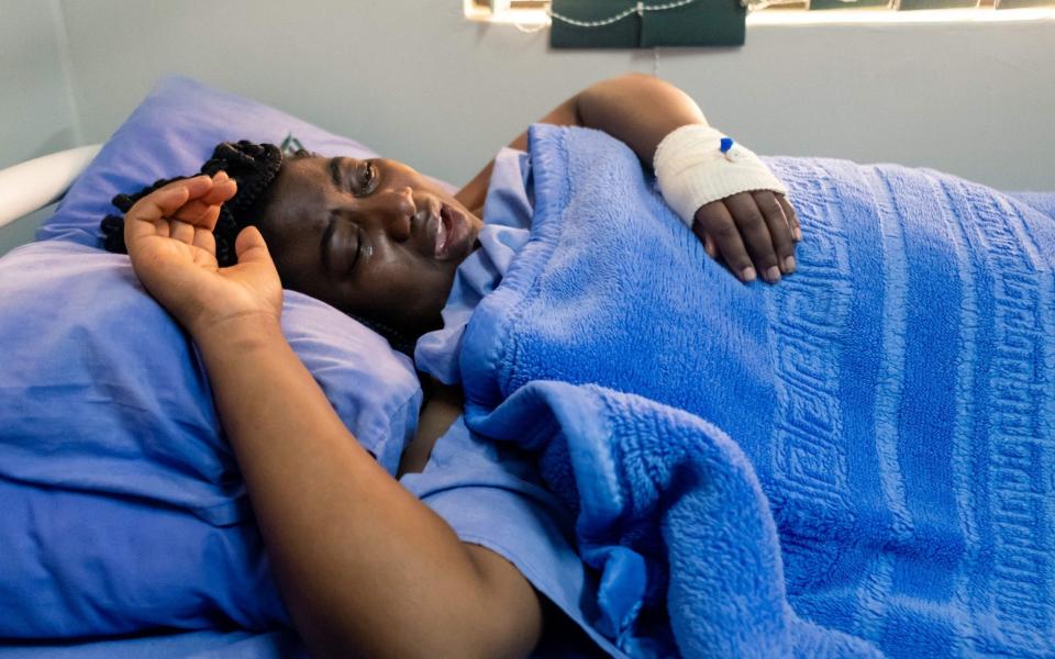 Joanne Mamombe, an MDC Alliance MP, lying on a hospital bed  - JEKESAI NJIKIZANA/AFP