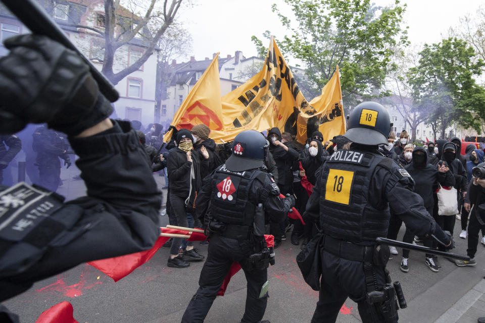 Police and demonstrators clash during the "Revolutionary May Day Demonstration" in Frankfurt Saturday, May 1, 2021. (Boris Roessler/dpa via AP)