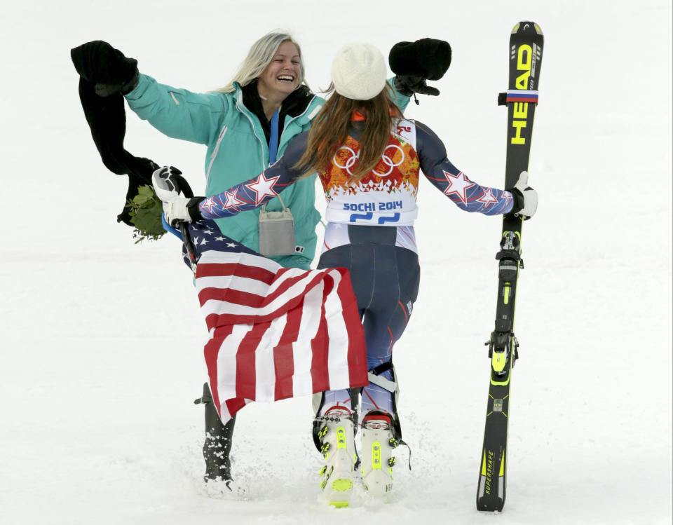 United States' Julia Mancuso celebrates her bronze medal win in the women's supercombined with her sister, Sara, at the Sochi 2014 Winter Olympics, Monday, Feb. 10, 2014, in Krasnaya Polyana, Russia. (AP Photo/Charles Krupa)