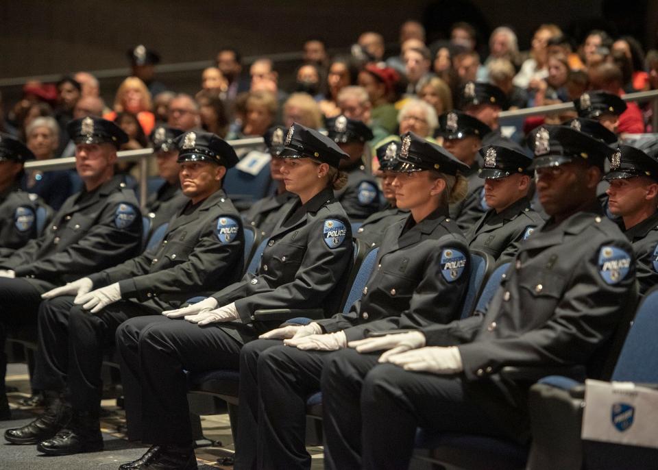 Officers listen in during the Worcester Police Department Class 01-21 graduation at Worcester Tech on July 9, 2021.