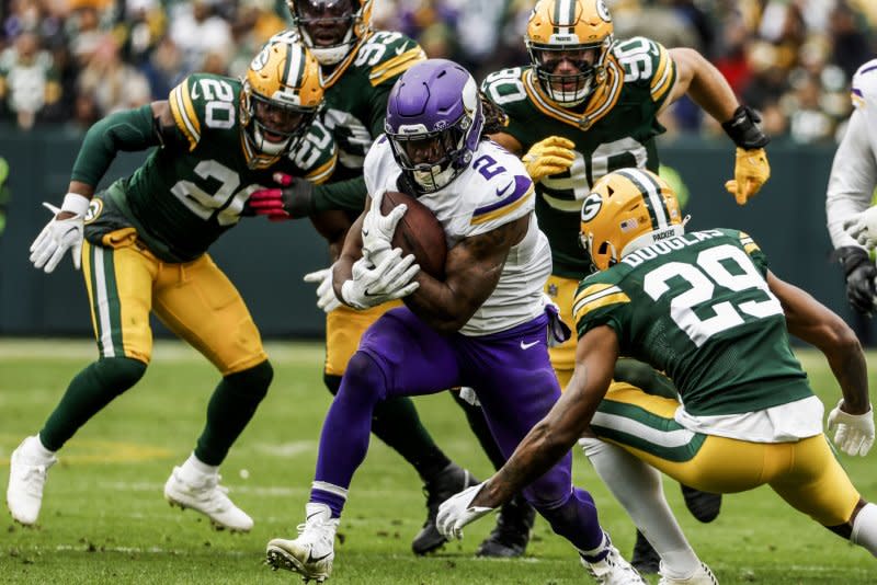 Minnesota Vikings running back Alexander Mattison (C) carries the ball against the Green Bay Packers on Sunday at Lambeau Field in Wis. Photo by Tannen Maury/UPI