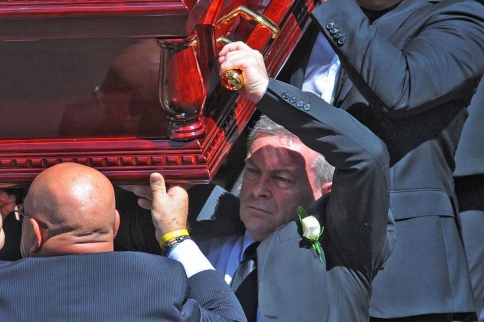 Borce Ristevski carries his wife's coffin at her funeral. Source: AAP