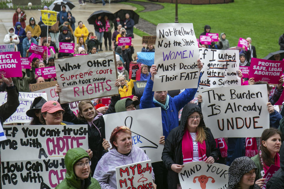 Protesters gather at the steps of the Michigan State Capitol (Daniel Shular / The Grand Rapids Press via AP file)