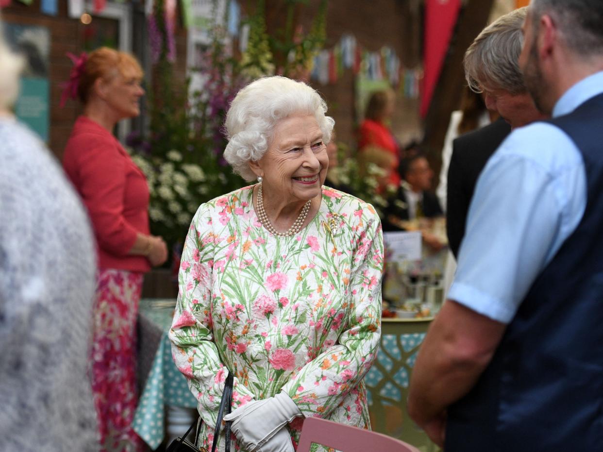 Queen Elizabeth II smiles as she meets people from communities across Cornwall (POOL/AFP via Getty Images)