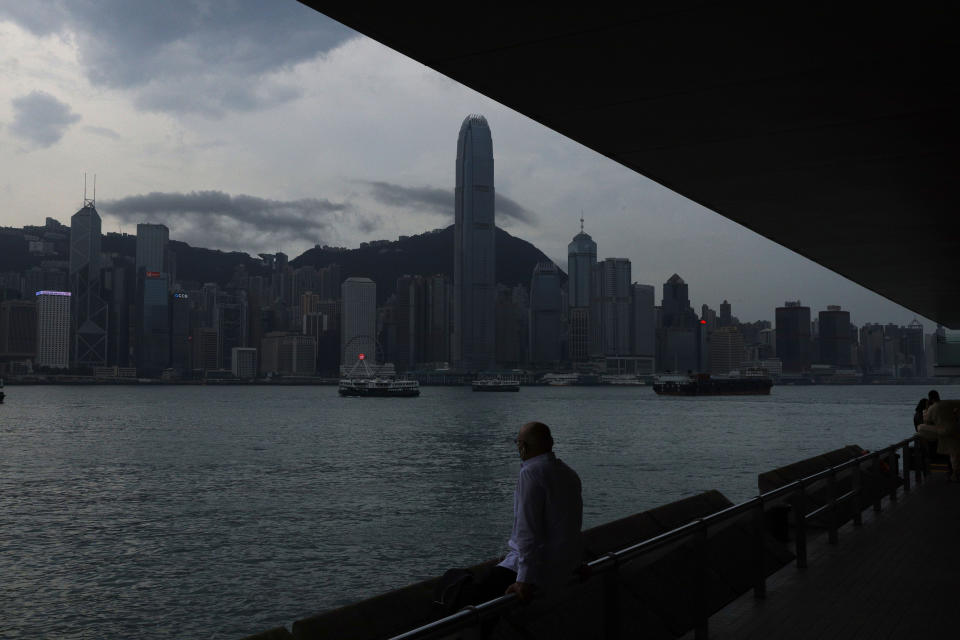 A man sits on the waterfront of the Victoria Harbor of Hong Kong Tuesday, May 26, 2020. Hong Kong has been living on borrowed time ever since the British made it a colony nearly 180 years ago, and all the more so after Beijing took control in 1997, granting it autonomous status. A national security law approved by China's legislature Thursday is a reminder that the city's special status is in the hands of Communist Party leaders who have spent decades building their own trade and financial centers to take Hong Kong's place. (AP Photo/Kin Cheung)