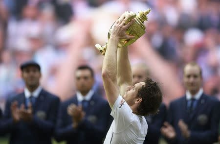 Britain Tennis - Wimbledon - All England Lawn Tennis & Croquet Club, Wimbledon, England - 10/7/16 Great Britain's Andy Murray celebrates winning the mens singles final against Canada's Milos Raonic with the trophy REUTERS/Tony O'Brien