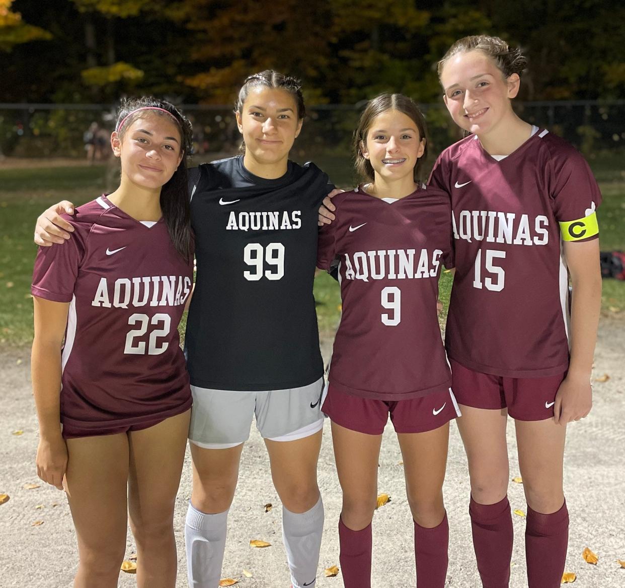 Aquinas' Juliana Sevio, goalkeeper Liz Tantalo, Sienna Fallone and Molly O'Toole after their 3-0 win over Greece Olympia in the Section V Class A semifinals Wednesday, Oct. 26 in Spencerport.