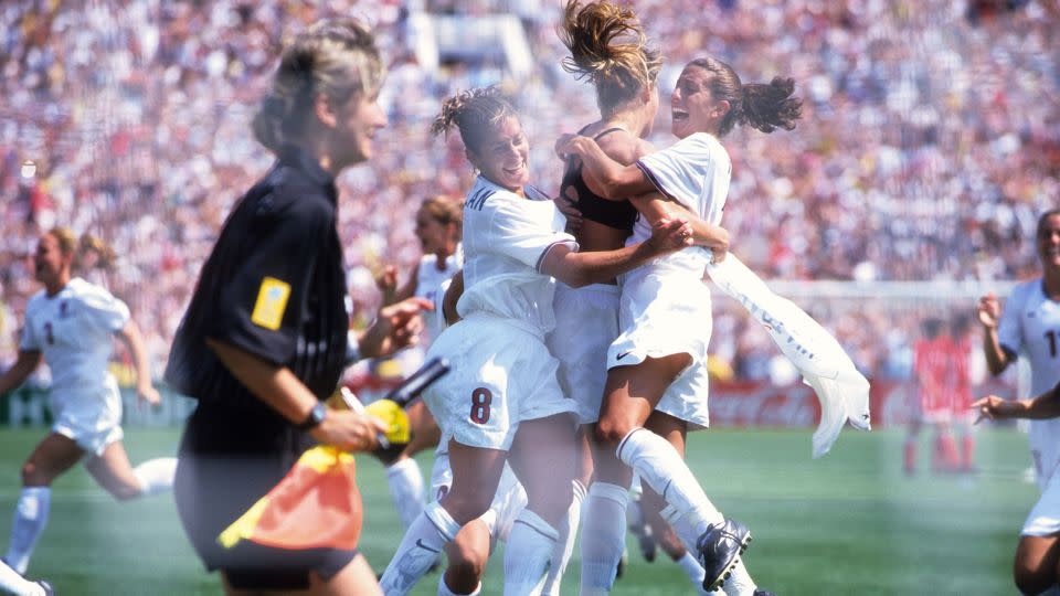 Brandi Chastain (6) celebrates with teammates after scoring the winning penalty in the 1999 final. - Robert Beck/Sports Illustrated/Getty Images