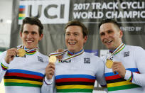 Cycling - UCI Track World Championships - Men's Team Sprint, Final - Hong Kong, China – 12/4/17 - New Zealand's Sam Webster, Ethan Mitchell and Edward Dawkins celebrate with gold medals. REUTERS/Bobby Yip