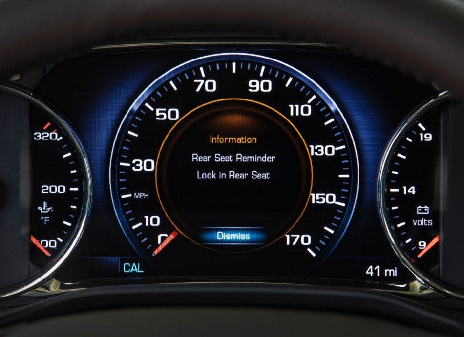Many new cars and trucks flash rear seat reminders when the driver switches off the ignition, as shown on this GM dashboard.