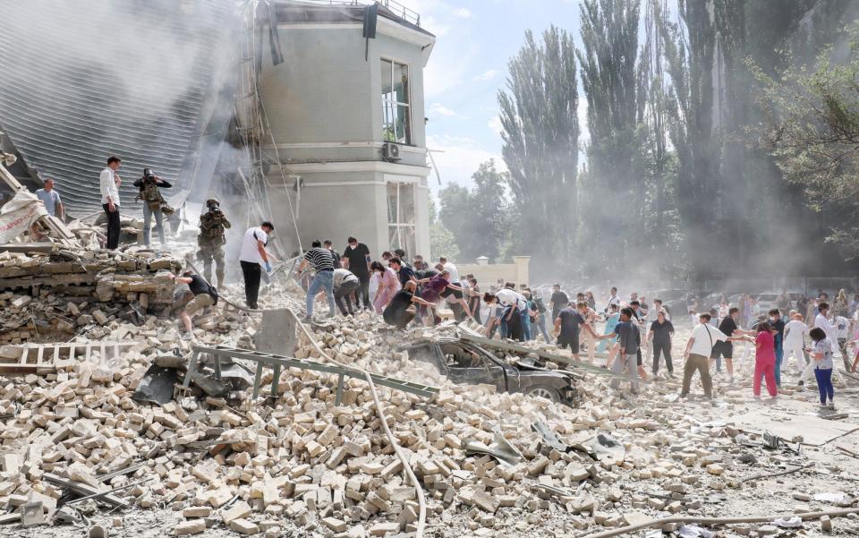 Rescuers work at Ohmatdyt Children's Hospital in Kyiv following a Russian missile attack