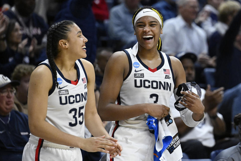 UConn's Aaliyah Edwards (3) celebrates with teammate Azzi Fudd (35) in the second half of a first-round college basketball game against Vermont in the NCAA Tournament, Saturday, March 18, 2023, in Storrs, Conn. (AP Photo/Jessica Hill)