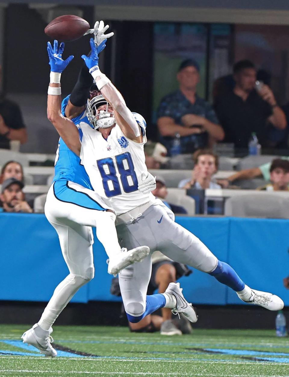 Carolina Panthers cornerback CJ Henderson, left, breaks up a pass meant for Detroit Lions wide receiver Chase Cota, right, during second quarter action on Friday, August 25, 2023 at Bank of America Stadium in Charlotte, NC. Pass interference was called on Henderson on the play.