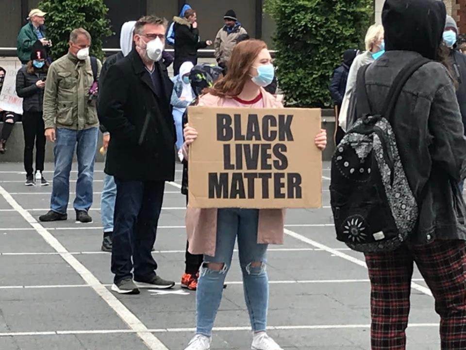 People take part in a Black Lives Matter protest rally in Custom House Square, Belfast (Rebecca Black/PA) (PA Archive)
