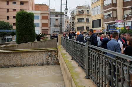 Spain's acting Prime Minister Pedro Sanchez visits the bridge over Segura river in a flooded town of Orihuela