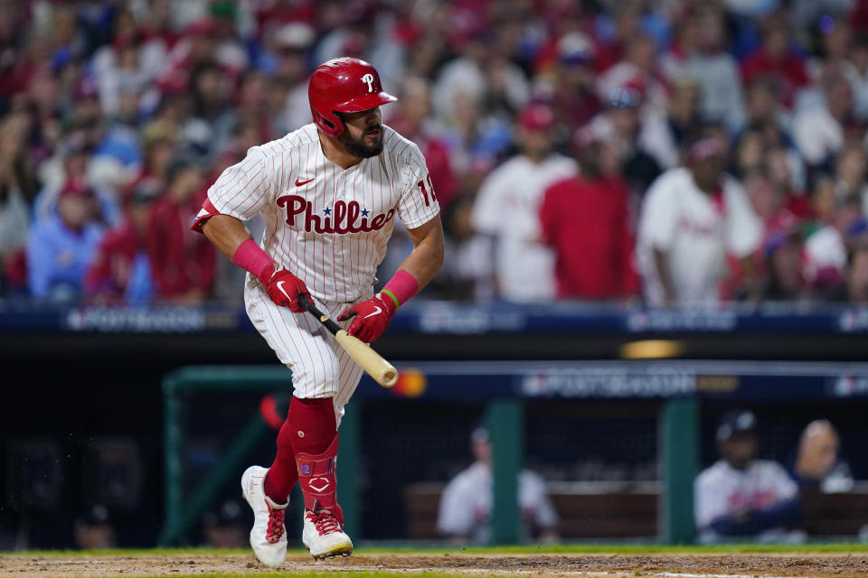 Philadelphia Phillies left fielder Kyle Schwarber (12) hits a single during the seventh inning in Game 3 of baseball's National League Division Series against the Atlanta Braves, Friday, Oct. 14, 2022, in Philadelphia. (AP Photo/Matt Rourke)