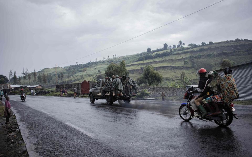 A Democratic Republic of Congo Armed Forces vehicle drives up the road to the front line in Goma on December 5, 2022 - GUERCHOM NDEBO/AFP via Getty Images