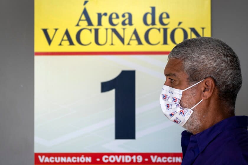 A man waits in line to be inoculated with the Moderna Covid-19 vaccine Puerto Rico on March 10, 2021.